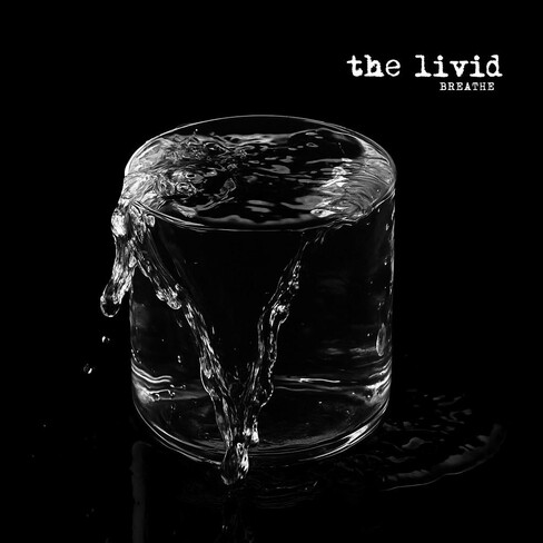 Breathe album cover: an overflowing glass of water on a black background